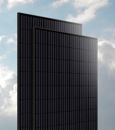 isolated black solar panels against blue cloud sky